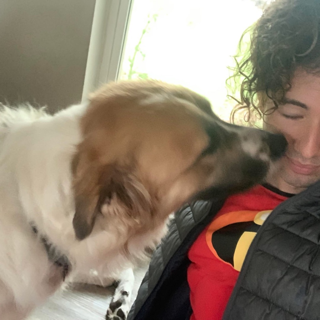 Josue Gonzalez with a client's dog